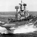 Seen in 1977 is HMS Ark Royal with a flight of Phantom, Buccaneer and Gannet aircraft on her flight deck.