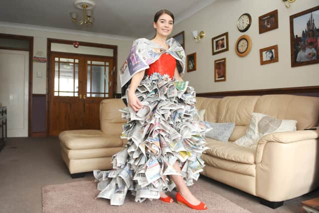 Madeleine Haddock, 16, from Waterlooville, has made a dress out of newspaper 
Picture: Sarah Standing (100320-6985)