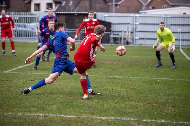 Zack Willett gets in a cross which Tommy Scutt headed in against US Portsmouth. Picture by Alex Shute