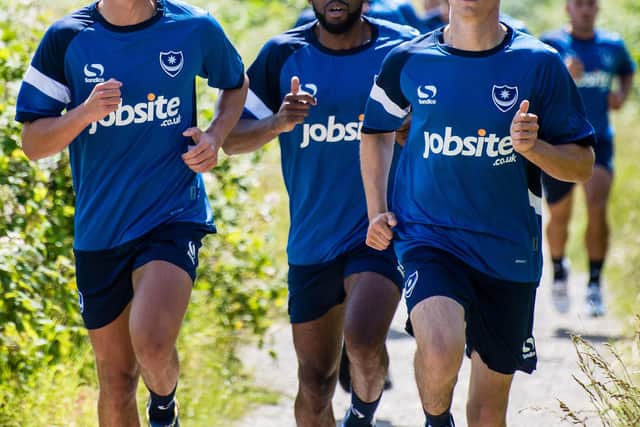 Nigel Atangana with Kal Naismith (left) and Brandon Haunstrup (right) during Pompey pre-season training in June 2015. Picture: Colin Farmery