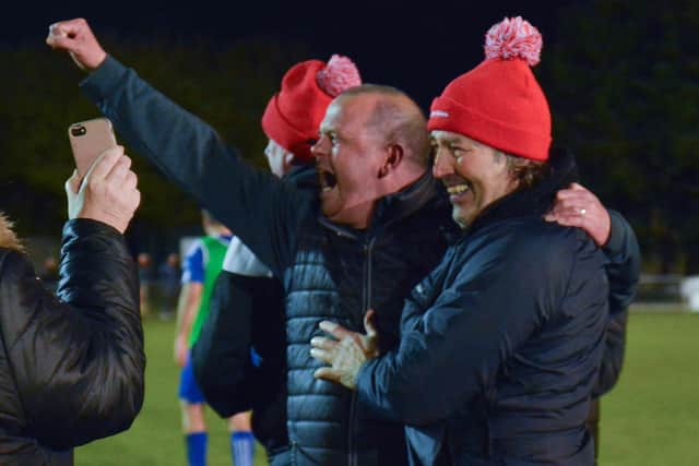 Horndean boss Michael Birmingham (middle) celebrates winning the Wessex League title last night. Picture by Martyn White