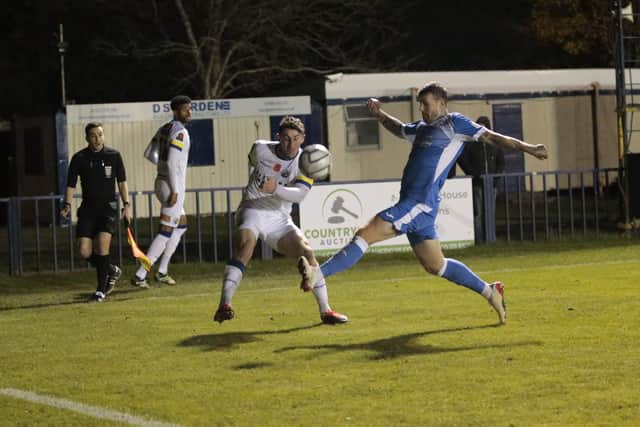 James Roberts gets a cross in at Tonbridge last night. Picture: Lily Moore.