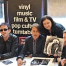 Suede doing an instore signing session at HMV in Commercial Road, Portsmouth with fans Sally and Andy Cornish from Southsea