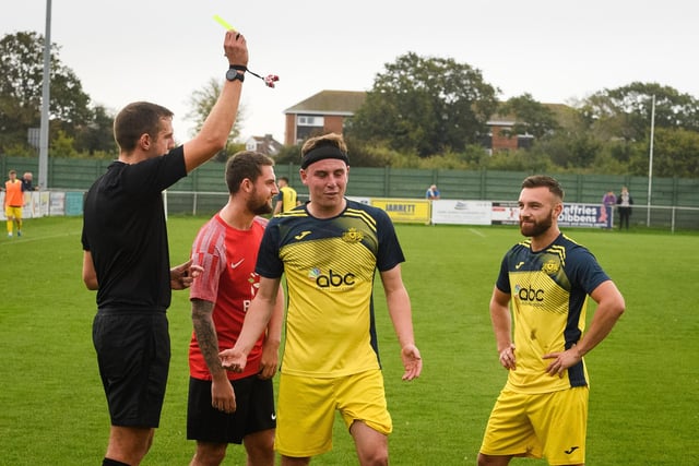 A Moneyfieds player is booked. Picture: Keith Woodland