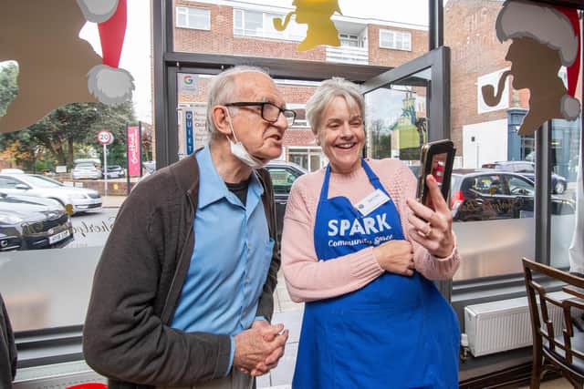 Robin Bartlett and Rebecca Simmons of Spark Community Space talking to Maisie on their phone at Sherlock's Bar, Southsea.

Picture: Habibur Rahman
