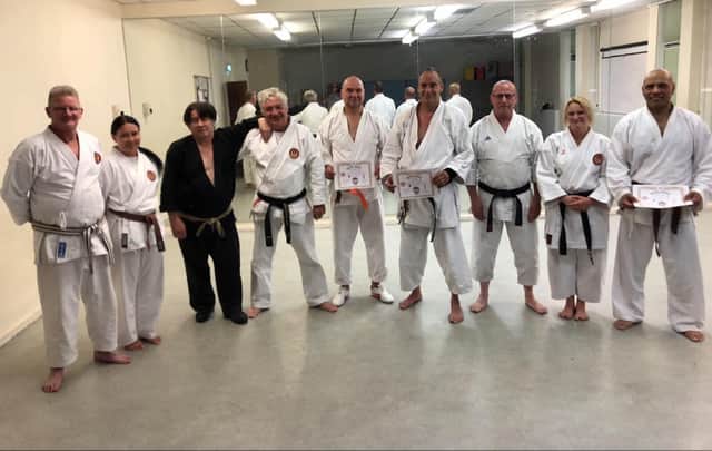 Karate instructor Bob Caruana was presented with a special gift for his 80th birthday from students past and present. Pictured: Bob, third from left, taken in 2019 after Bob's last student grading. This included the 3rd Dan Black belt grading for one of his lifelong students John Aquilina
