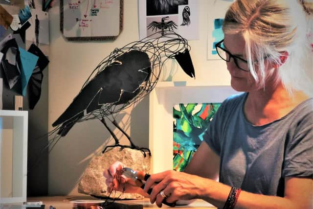Sculptor/painter Deborah Hochreutener at work in her studio