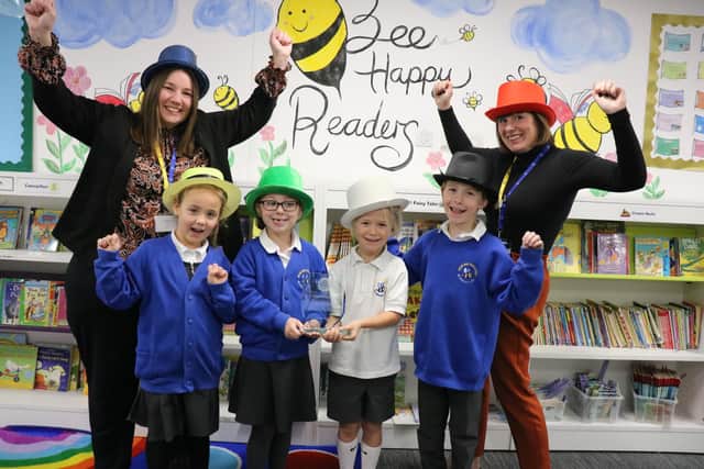 Moorings Way Infant School - Executive Headteacher Sara Paine (L) and Head of MWIS Ruth Vonk (R) celebrate the school's accreditation with children.
Picture: Samuel Poole