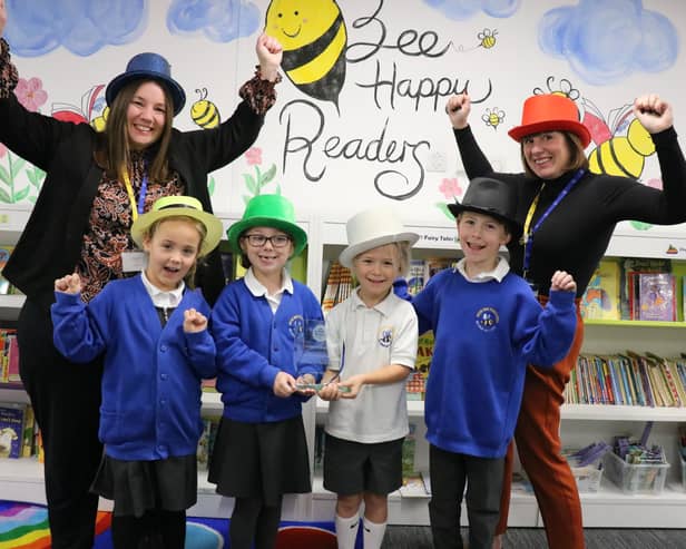 Moorings Way Infant School - Executive Headteacher Sara Paine (L) and Head of MWIS Ruth Vonk (R) celebrate the school's accreditation with children.
Picture: Samuel Poole