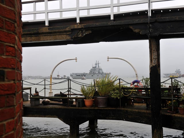 The ITS Giuseppe Garibaldi heading into Portsmouth - with HMS Queen Elizabeth spotted in the background