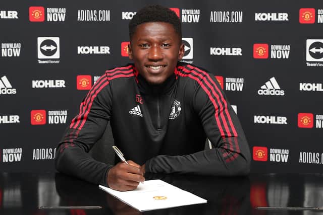 Manchester United defender Di'shon Bernard poses after signing a new contract at the Red Devils in July 2021     Picture: Matthew Peters/Manchester United via Getty Images