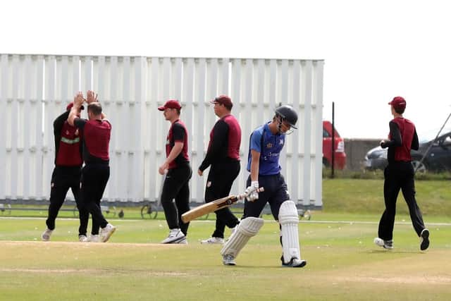 South Wilts celebrate as Jack Collett trudges off after being dismissed. Picture: Sam Stephenson