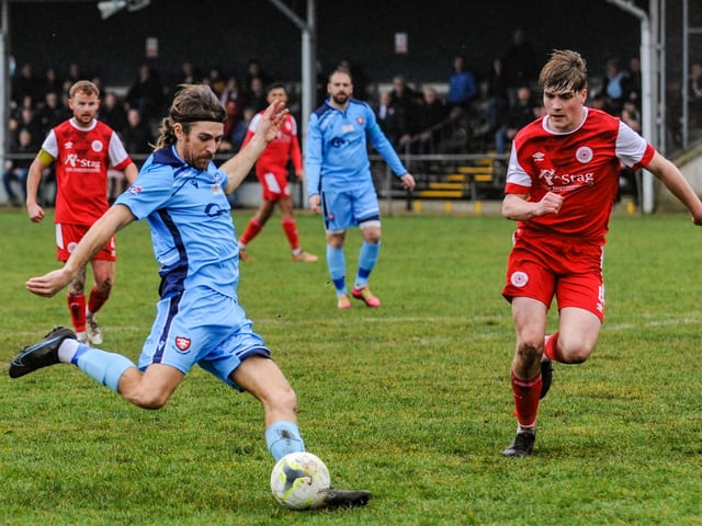 Scott Jones lines up a shot for AFC Portchester (blue) v Bournemouth Poppies. Picture by Daniel Haswell