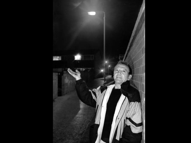 Delighted Peter Carter (52) of Park Walk, Fareham, in the alleyway where lighting has now been restored, 1995. The News PP5757