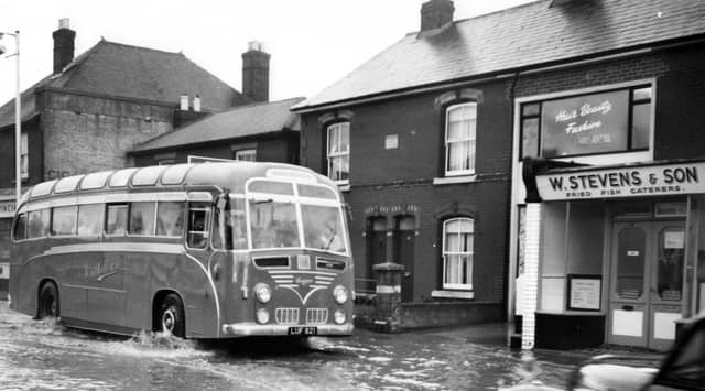 Portchester flood
A Southdown coach makes a bow wave through Portchester.
