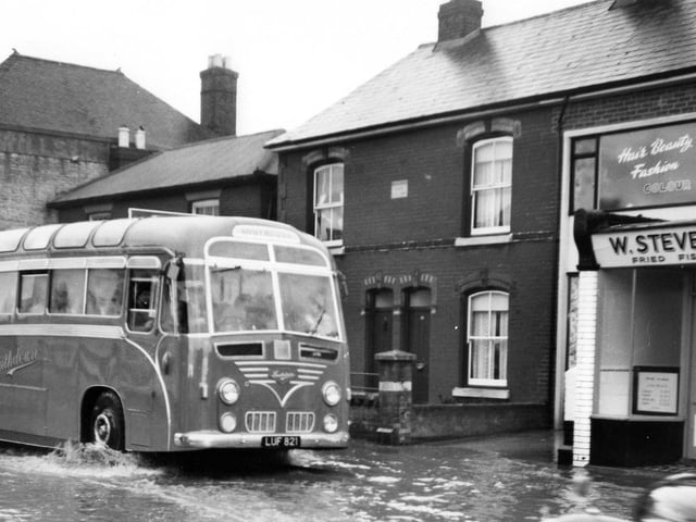 Portchester flood
A Southdown coach makes a bow wave through Portchester.