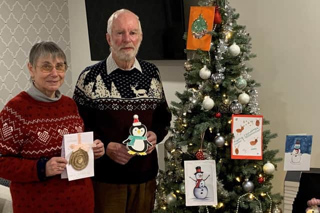 Margaret and Graham Spooner from Shilling Place with some of the cards from Purbrook Park pupils