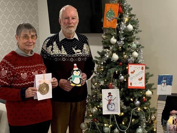 Margaret and Graham Spooner from Shilling Place with some of the cards from Purbrook Park pupils