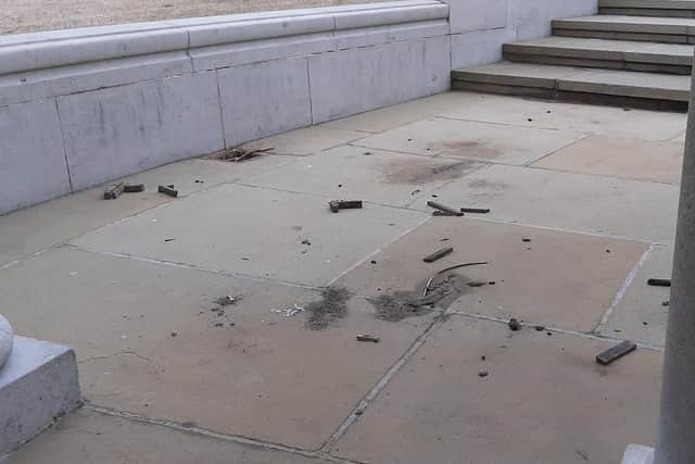 Debris inside the naval memorial following an attack by vandals.