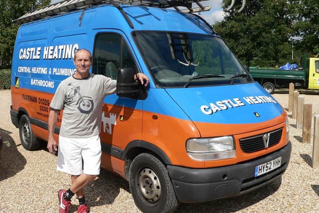 Ray Mouland, in front of a Castle Heating van.