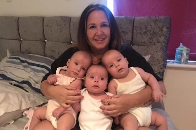 Kimberly Robb is thanking Baby Basics Portsmouth for helping when her triplets were born. Pictured: Kimberly with triplets Elsie, Emmy and Addison