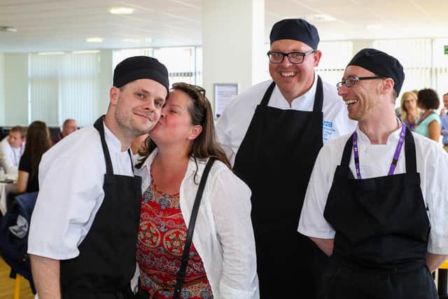 Sealed with a kiss - from left, Joe Hennigan, mum Heather, Jim Richardson and Dave Smith. Picture by Dominic Parkes