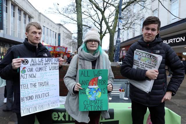 Members of Extinction Rebellion - from left, Chris Price, Selma Heimedinger and Nathan Widdowson during a protest in Commercial Road, Portsmouth.
Picture: Chris Moorhouse (211219-26)
