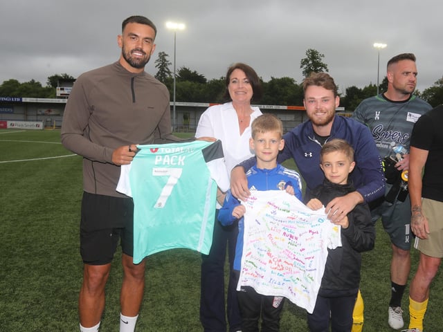 Pompey player Marlon Pack will present's Lenny's mother with a signed shirt, with staff and pupils from Langstone Infant School.