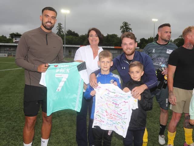 Pompey player Marlon Pack will present's Lenny's mother with a signed shirt, with staff and pupils from Langstone Infant School.