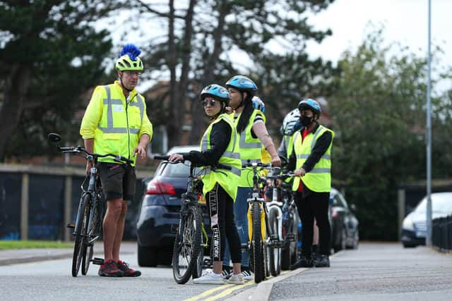 Action Asylum volunteers learn to ride bikes, Eastney. They are pictured with their coach, Adrian, left
Picture: Chris Moorhouse (jpns 060721-14)
