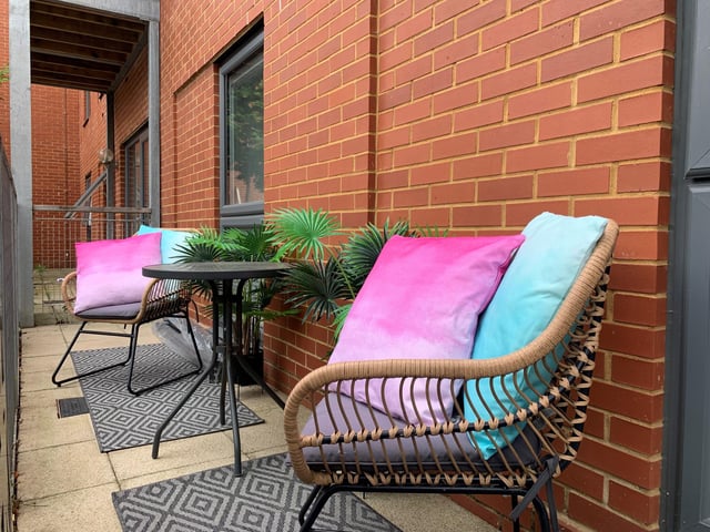 The ground floor features a balcony space.