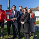 Alan Mak MP (centre) with Royal Mail Chief Executive Emma Gilthorpe (left) and Royal Mail staff at the new Stoke post box on Hayling Island