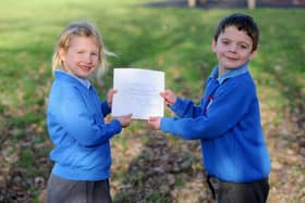 Erin Woodford (5) and Edward Morton (5) with the letter from Sir David Attenborough.

Picture: Sarah Standing (310123-5137)