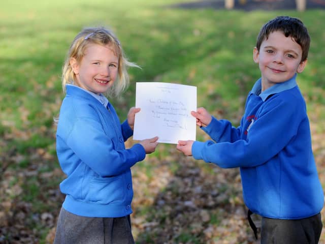 Erin Woodford (5) and Edward Morton (5) with the letter from Sir David Attenborough.

Picture: Sarah Standing (310123-5137)