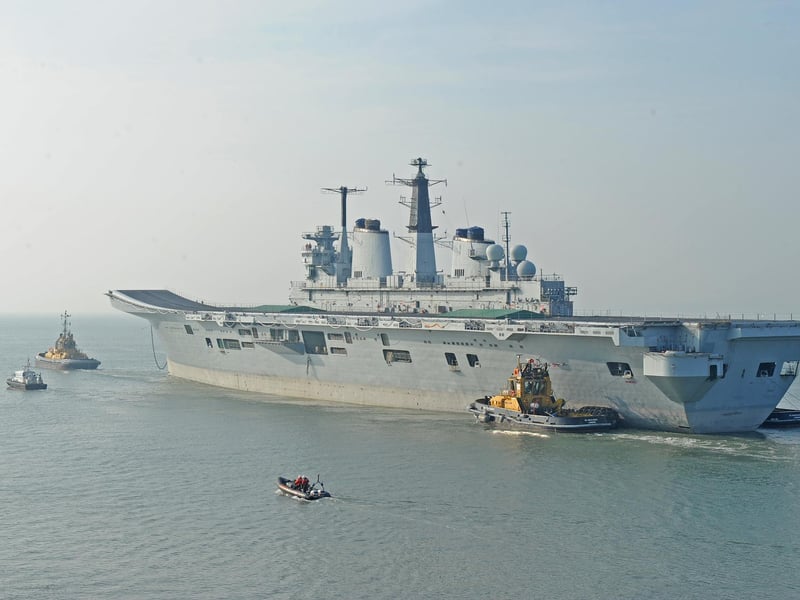 The sad farewell. HMS Invincible leaving Portsmouth for the last time and heads to Turkey to be recycled and turned in to razor blades and saucepans. 24th March 2011. Picture: Sarah Standing (111079-7522)