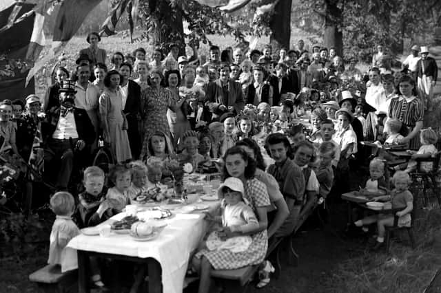 VE Day St James’s Hospital, Milton. Under shady trees to keep off the hot sun,staff and their children from St James's Hospital celebrate the peace with a party.