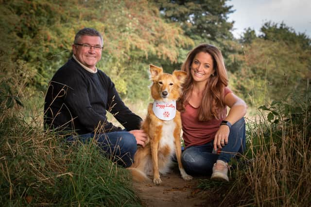 Doggy Lottery has been launched by a pair of cousins hoping to raise funds for rescue centres. Pictured: Lee Brown, Beautie the rescue dog and Lisette van Riel