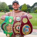 Mikey McKinson with his WBO Global and European and WBC international silver and world youth belts. Picture: Stuart Martin (220421-7042)