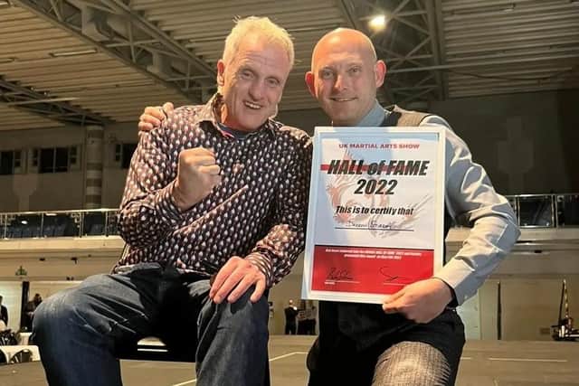 Gosport's Daren Stirrat, right, alongside idol and former Shokotan Karate world champion Bob Sykes with his UK Martial Arts hall of fame inductee certificate