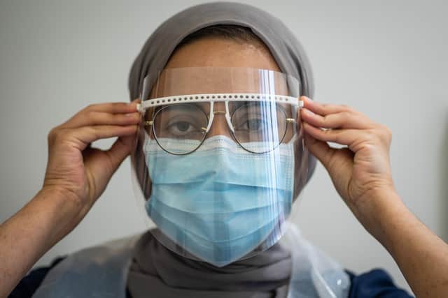 Staff put on PPE at St Michaels Dentist, Wakefield, West Yorkshire, as dentists open after Covid-19 lockdown. June 08 2020.   See SWNS story SWLEopen Today is the first day which dentists have been able to open after the coronavirus lockdown.