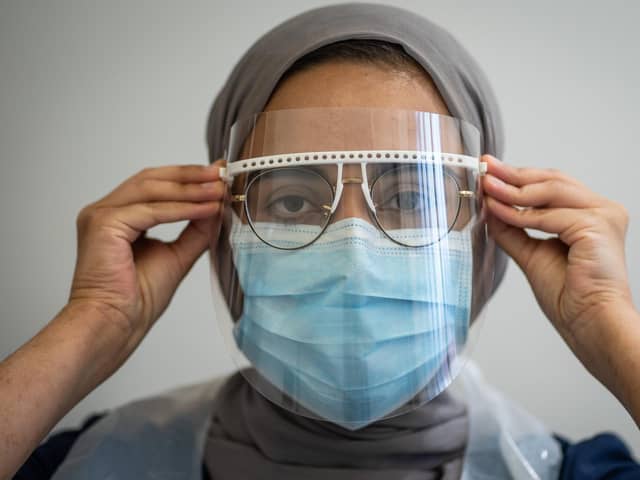 Staff put on PPE at St Michaels Dentist, Wakefield, West Yorkshire, as dentists open after Covid-19 lockdown. June 08 2020.   See SWNS story SWLEopen Today is the first day which dentists have been able to open after the coronavirus lockdown.