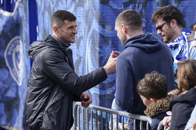 Pompey head coach John Mousinho takes time out of his pre-match preparations to say hello to these supporters