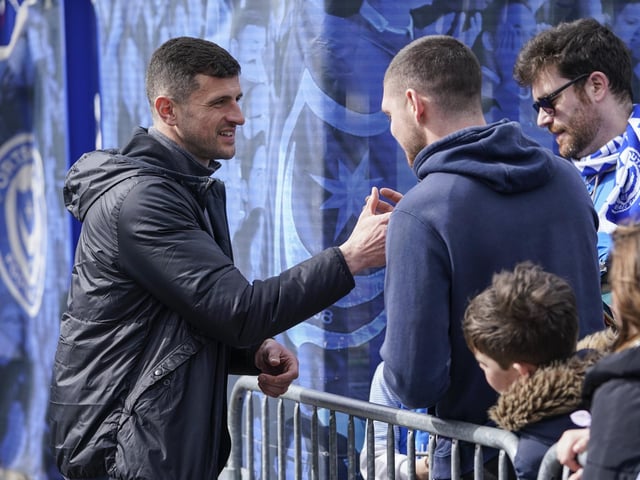 Pompey head coach John Mousinho takes time out of his pre-match preparations to say hello to these supporters