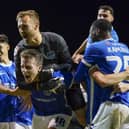 Pompey celebrate their come-from-behind win against Wycombe