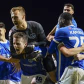 Pompey celebrate their come-from-behind win against Wycombe