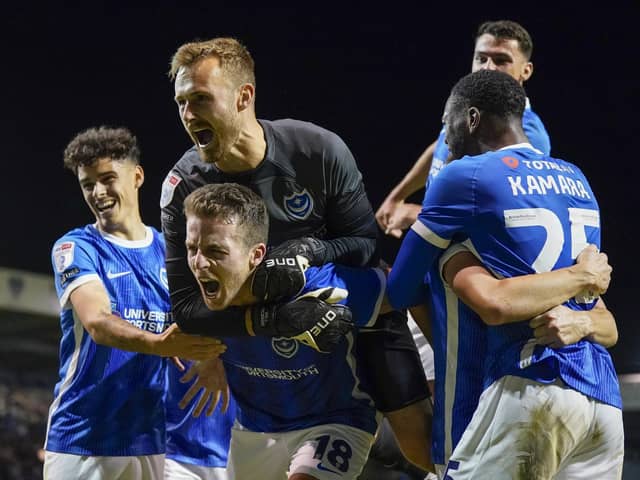 Pompey celebrate their come-from-behind win against Wycombe