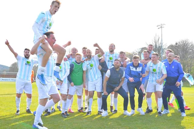 James Franklyn hitches a ride on Tom Cain's shoulders as US Portsmouth celebrate their FA Vase fifth round win at Tavistock. Picture: Martyn White.