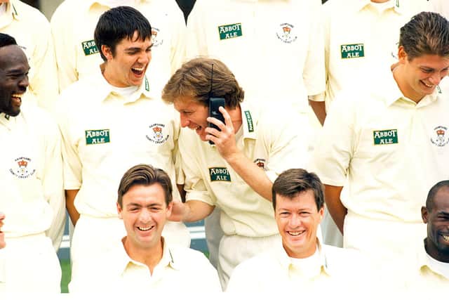 Flashback -  Kevan James takes a call on his new mobile phone at a Hampshire pre-season call in the late 1990s. Also pictured are (middle row) Winston Benjamin and Martin Thursfield and (front) John Stephenson, Paul Terry and Cardigan Connor