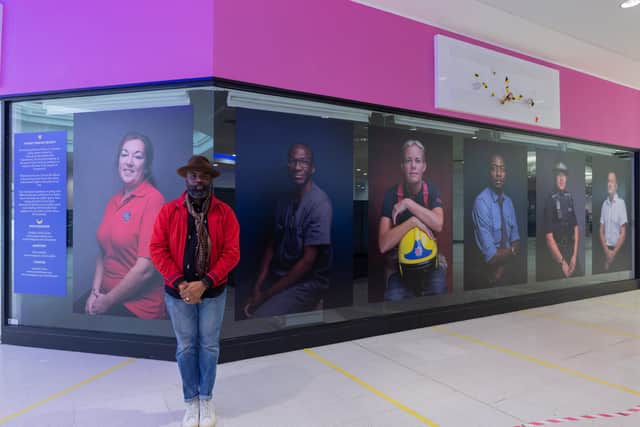 Photographer Olufemi Olaiya has succeeded in raising funds to display his Portsmouth Heroes Project work celebrating key workers in Cascades Shopping Centre. Pictured: Femi Olaiya with the Pompey Heroes Project on display