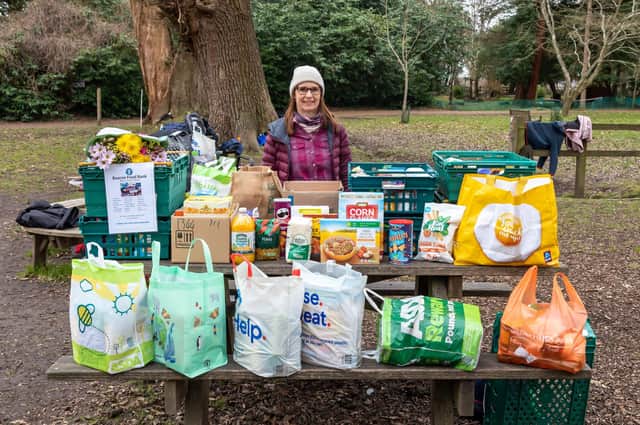 Belinda Moore, from the Beacon Food Bank - based in the Meridian Centre - with donations received from attendees at the Havant parkrun. Picture: Mike Cooter